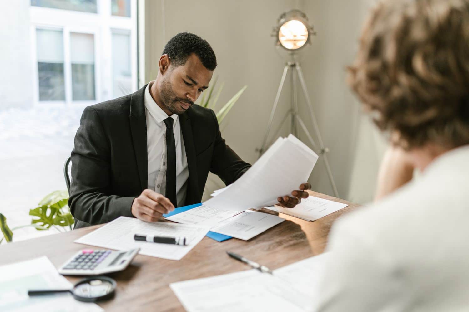 background-check-document-review-employment-screening Background check investigator reviewing candidate documents and records during professional employment screening in California, Florida and Texas